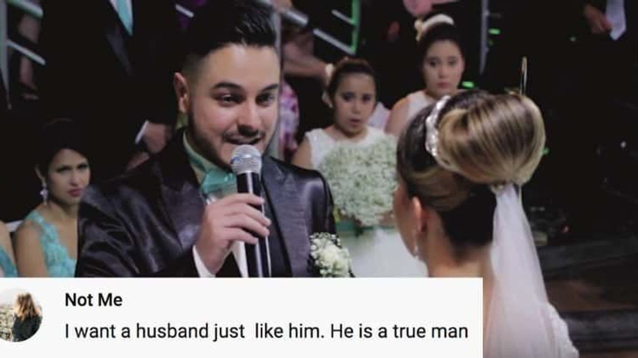 A groom speaks into a microphone during his wedding, addressing someone special in the audience.