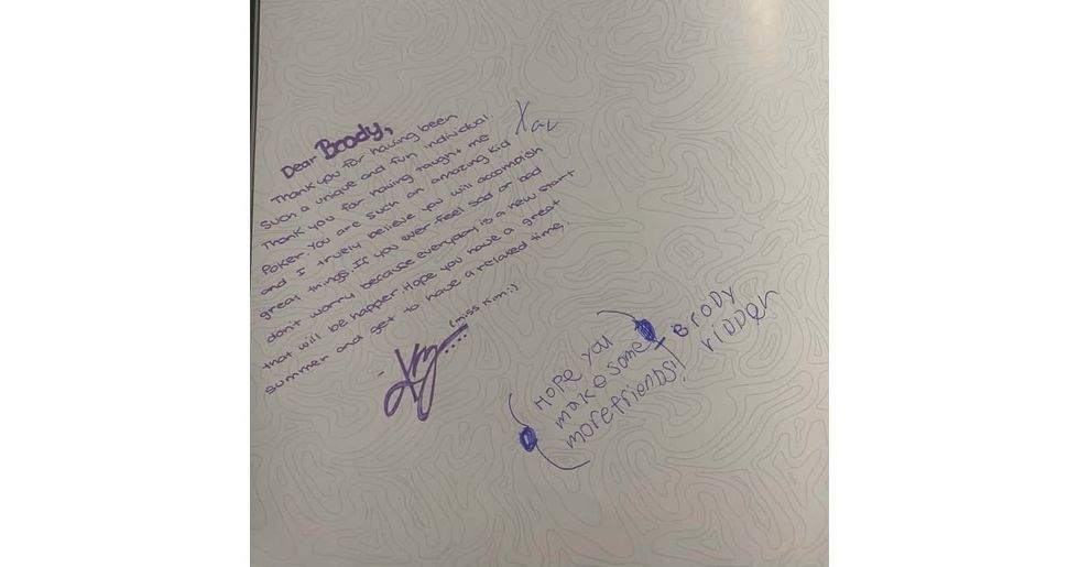 A page from a yearbook showing only two signatures.