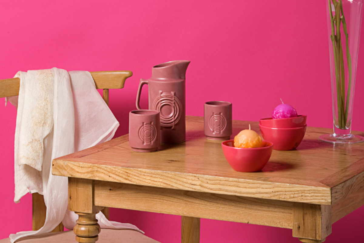 Desk against a fuchsia-pink wall