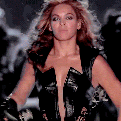 gif of beyonce pointing to her ring finger during a performance