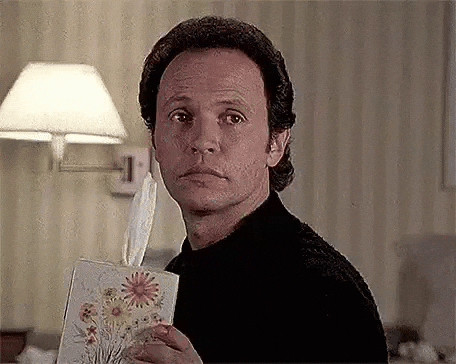 gif of man handing someone a box of tissues