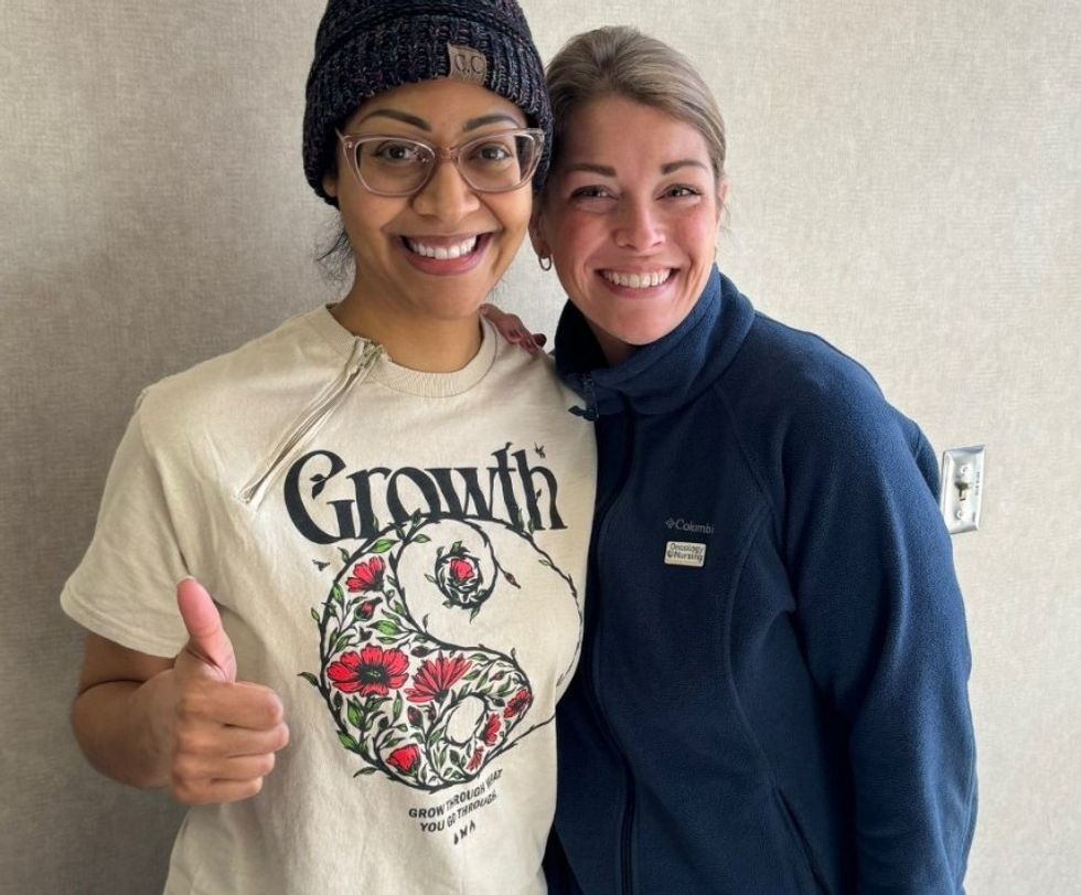 Nurse Whitney Carpenter with a patient.