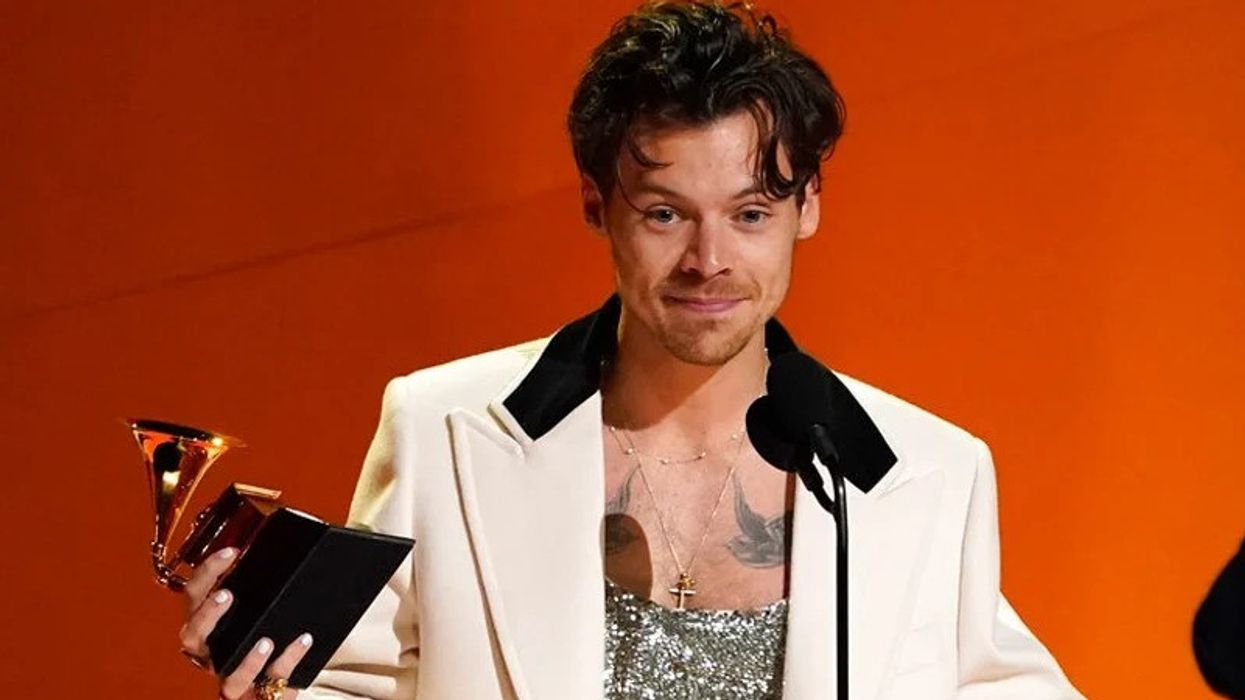 Singer Harry Styles holding his Grammy